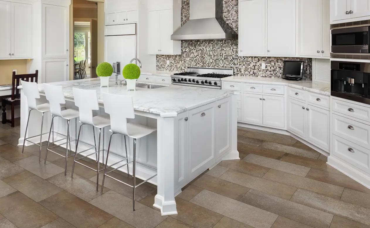 tile floor in kitchen with marble countertops