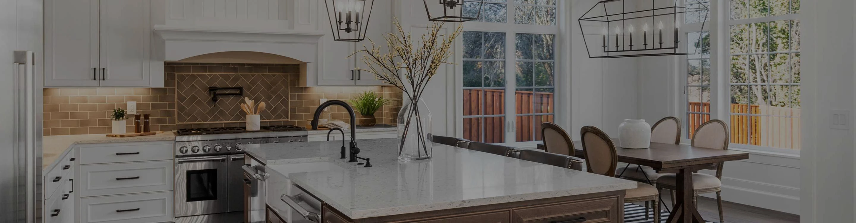 dark wood-look flooring in a kitchen with white cabinetry